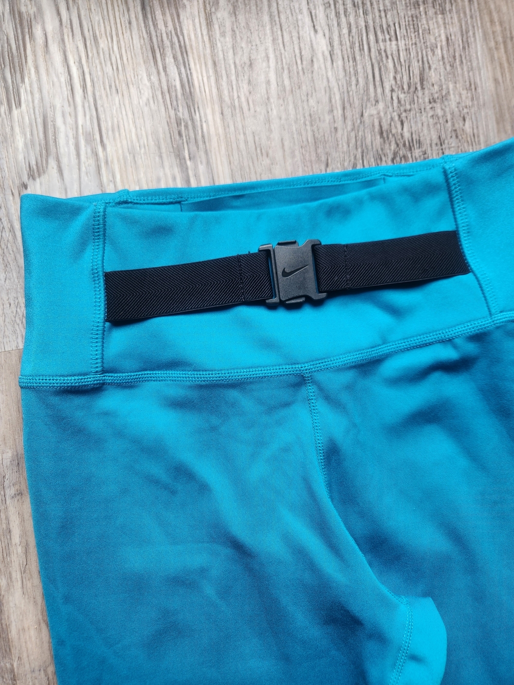 Nike Dri-FIT One Luxe Buckle Mid-Rise Leggings in a Cyber Teal color - Picture 5 of 6